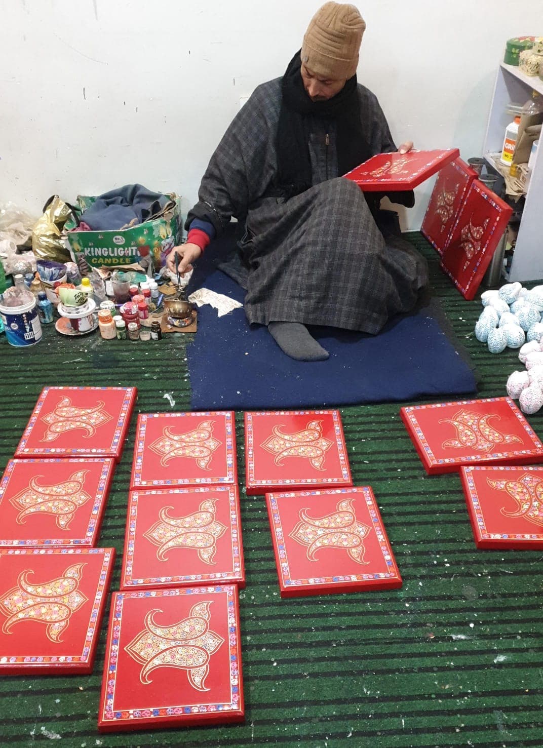 Master Naqash artisan hand-painting custom order boxes in Kashmir