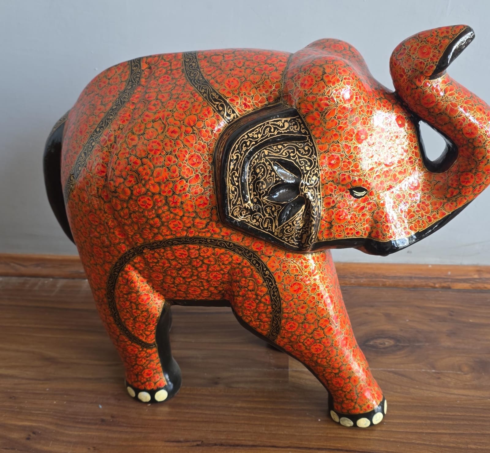 Red and gold hand-painted paper-mache elephant